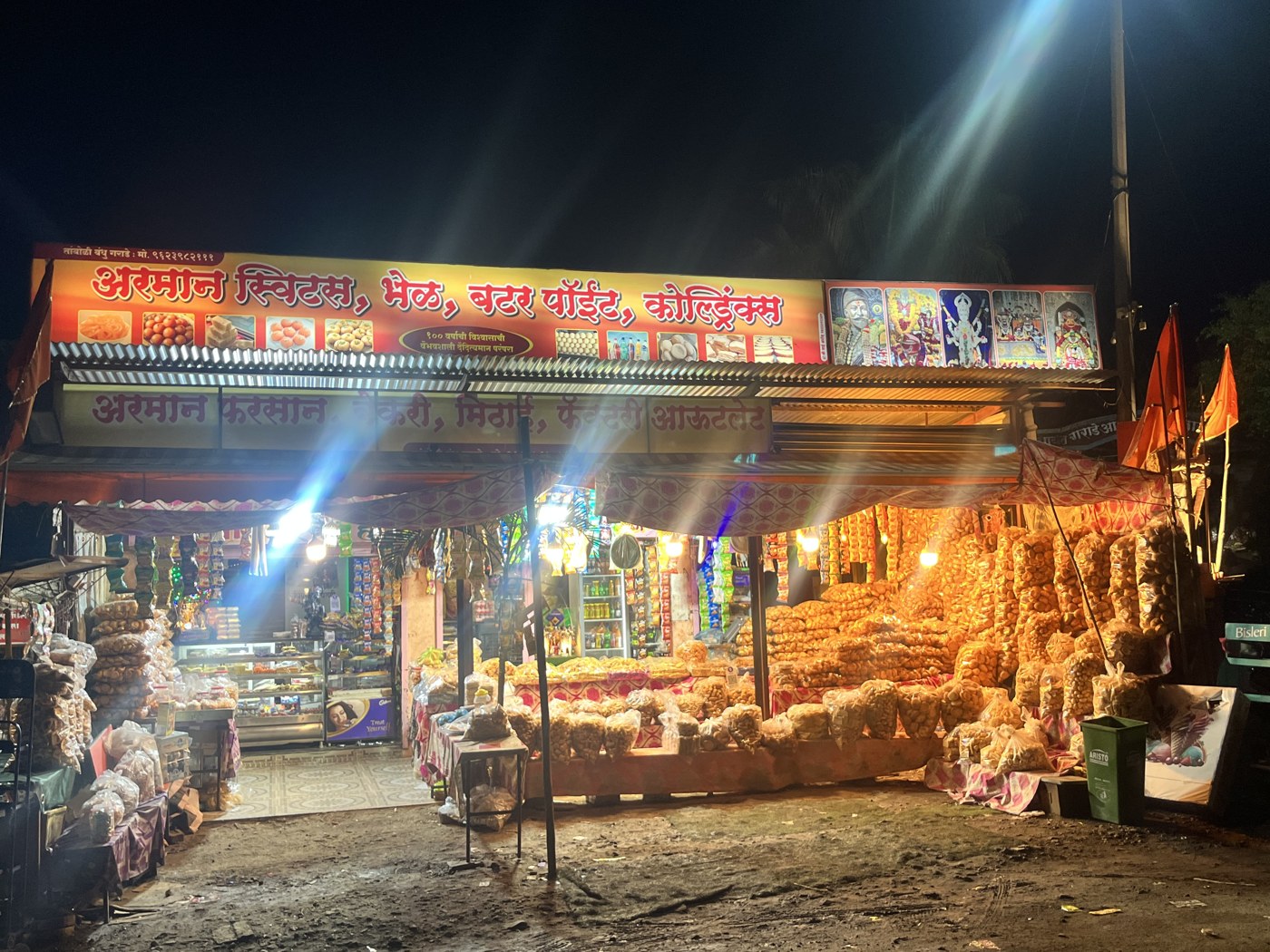 Arman Sweets, Bhel, Butter Point & Cold Drinks — the real shopfront lit up at night